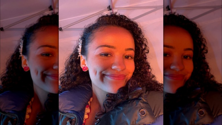 A selfie with ppink lighting of Marissa Bode without makeup