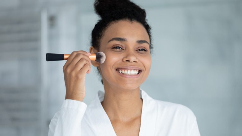 Woman applying powder