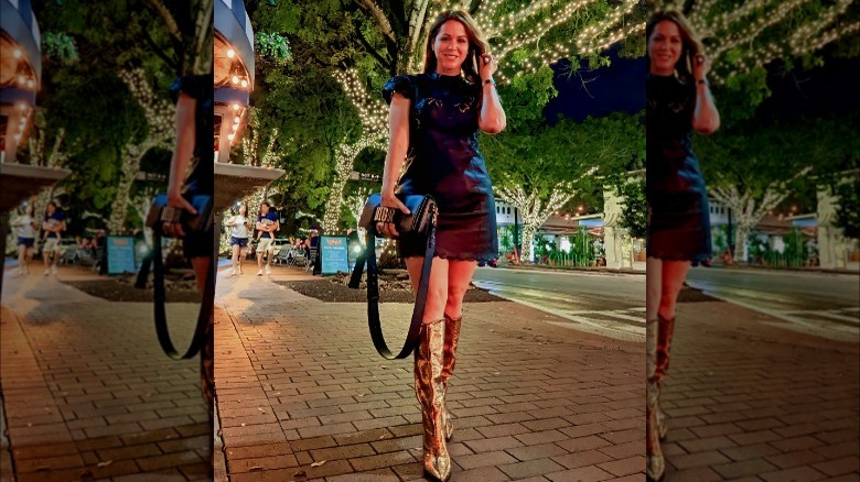 woman wearing black dress with metallic boots
