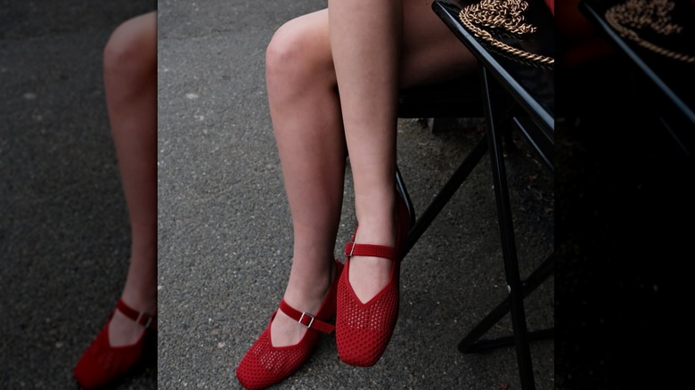 Influencer Sofia Mos wearing red flats from Vivaia with a square toe box