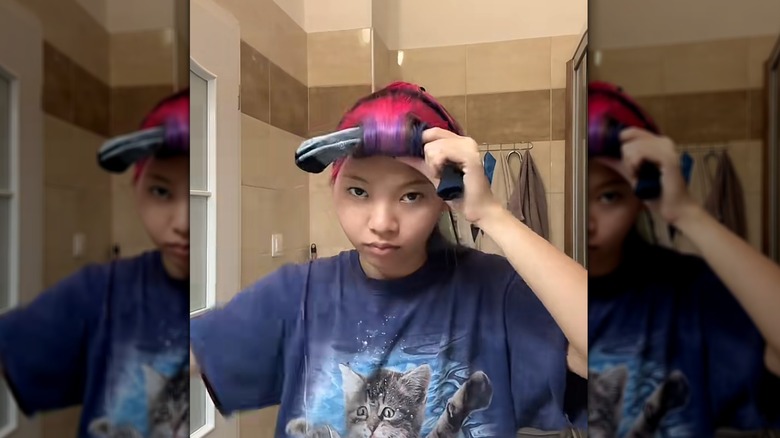 A woman on TikTok showing a four-part sock combo of heatless curls