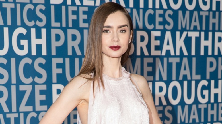 Lily Collins posing on the red carpet