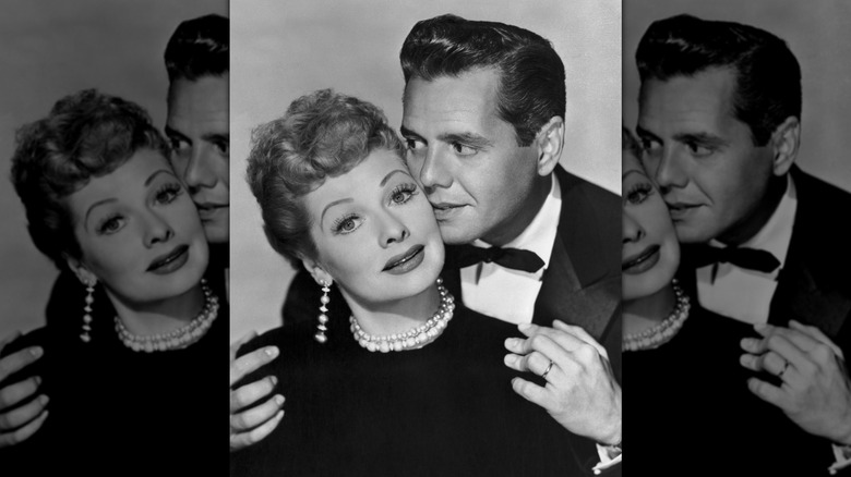 Lucille Ball and Desi Arnaz posing together as he kisses her cheek