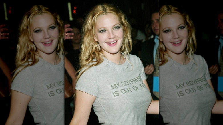 Drew Barrymore smiles wearing a gray T-shirt