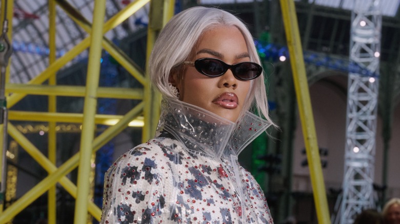Teyana Taylor with a neutral expression, dark sunglasses, and gray hair at Paris Fashion Week 2026