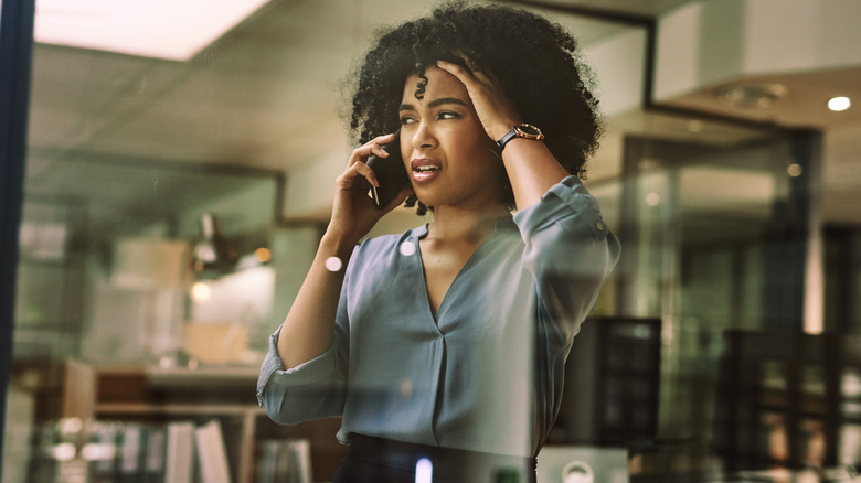 woman stressed on the phone