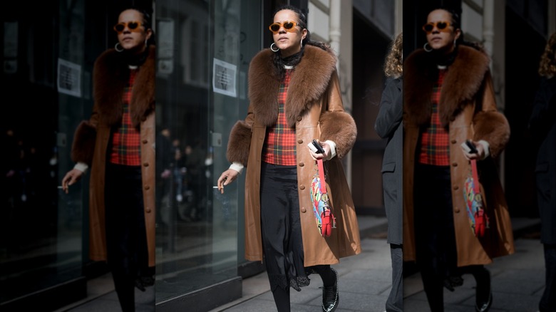 A woman in a brown jacket 