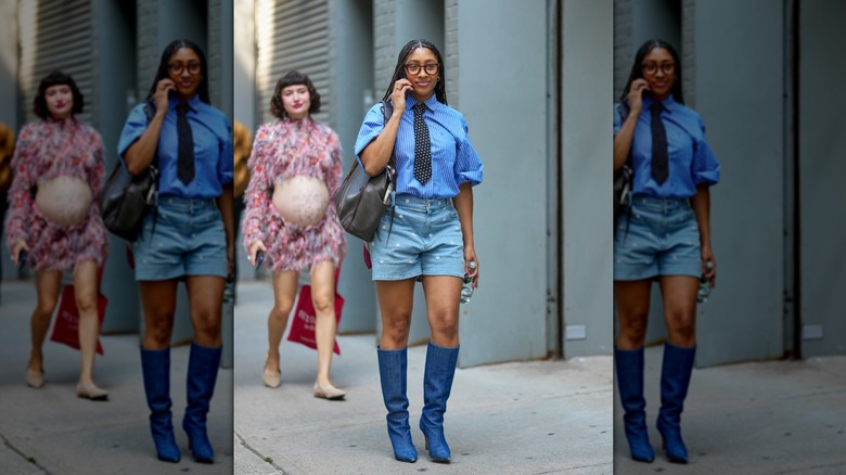 A guest of NYFW is pictured wearing various prints on their top and bottom