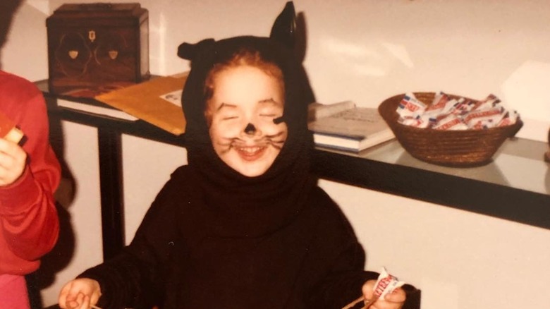 Ellie Kemper dressed as a cat as a child