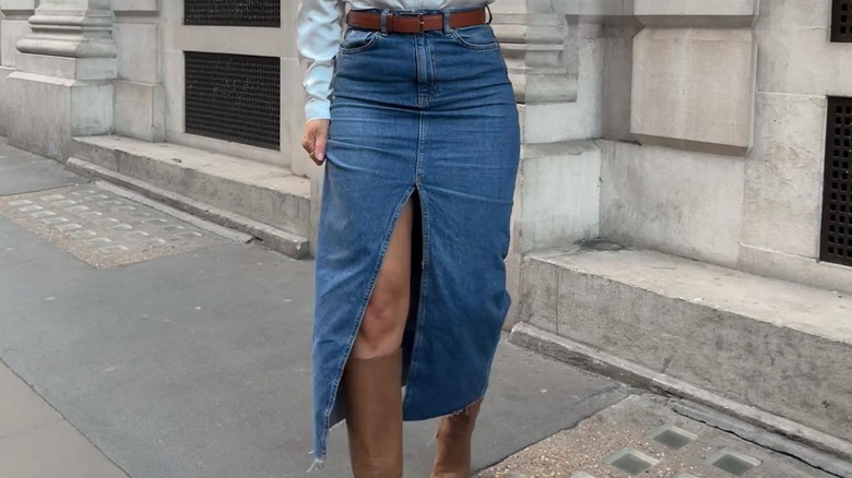 A woman in a denim maxi skirt