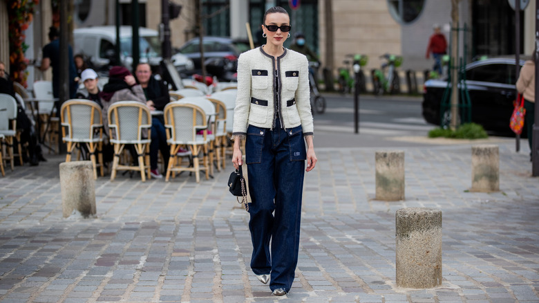 A young woman in dark denim 