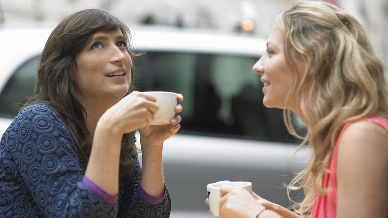 Two women talking outside