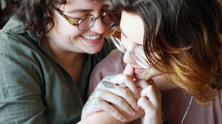 Two women holding each other close