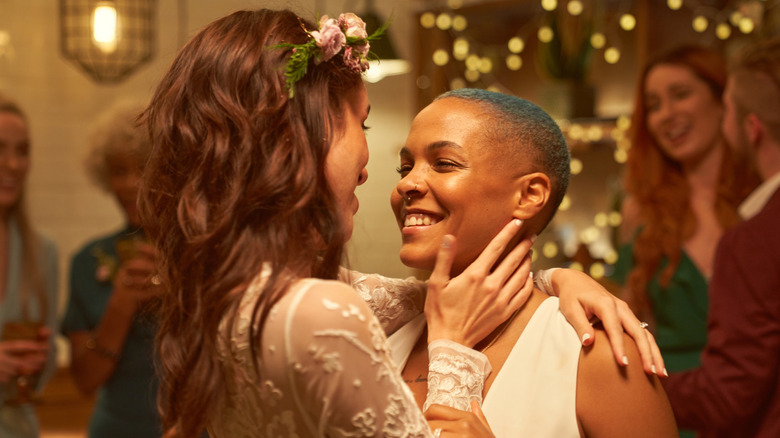 Queer couple dancing at their wedding