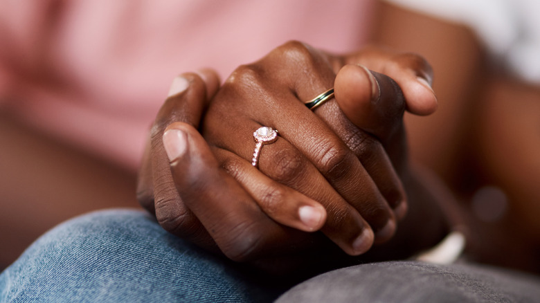 close up of hands with rings