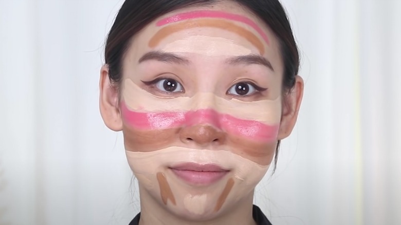 Woman trying the rainbow contour hack 