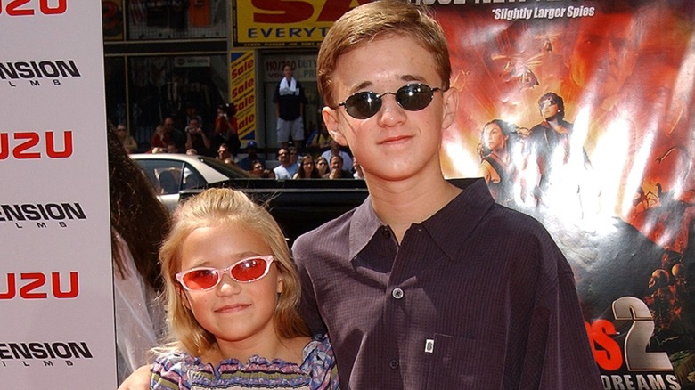 Emily Osment with Haley Joel Osment at the "Spy Kids 2: The Island Of Lost Dreams" Premiere in 2002