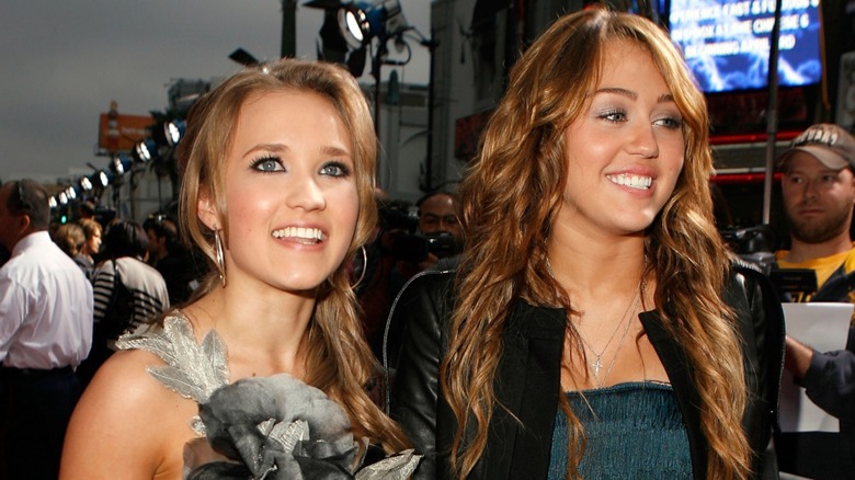 Emily Osment with Miley Cyrus at Hannah Montana: The Movie premiere in 2009