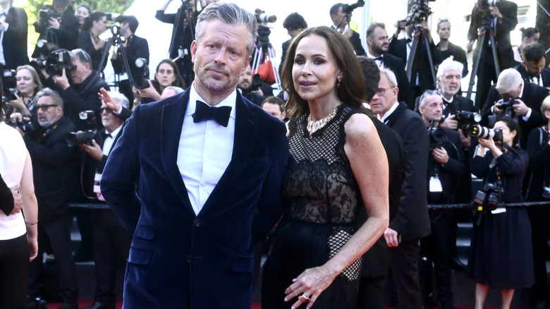 Hugh Addison White O'Dea and Minnie Driver attend the "The History Of Sound" red carpet at the 78th annual Cannes Film Festival at Palais des Festivals on May 21, 2025