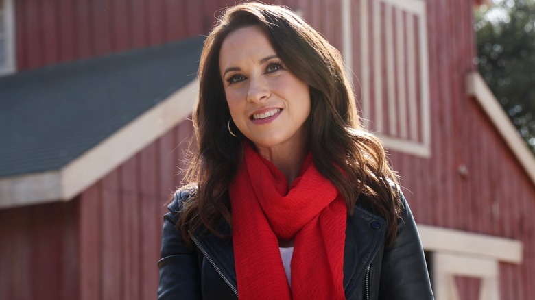 Lacey Chabert wearing a scarf in a movie