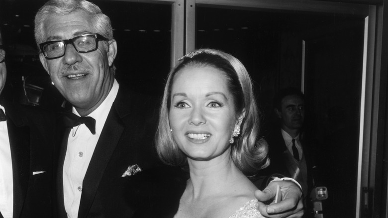 Debbie Reynolds and Harry Karl at an event in black and white