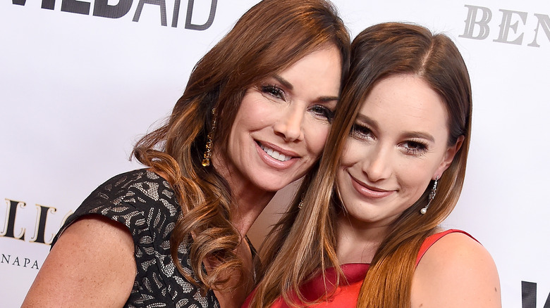 Debbe Dunning posing with her daughter Spencer Timmons