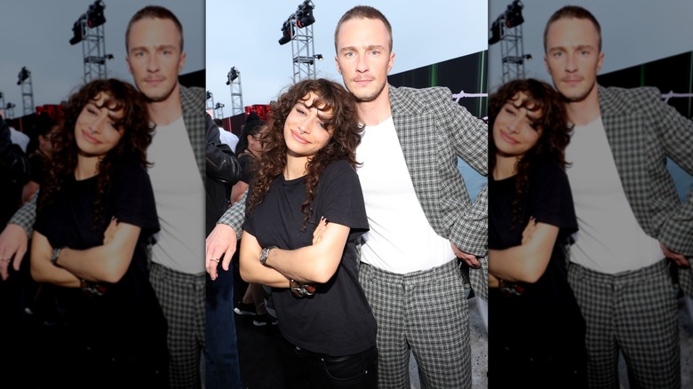 Odessa A'Zion crossing her arms while leaning against rumored boyfriend Drew Starkey at a 2025 event