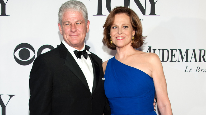 Jim Simpson and Sigourney Weaver posing together