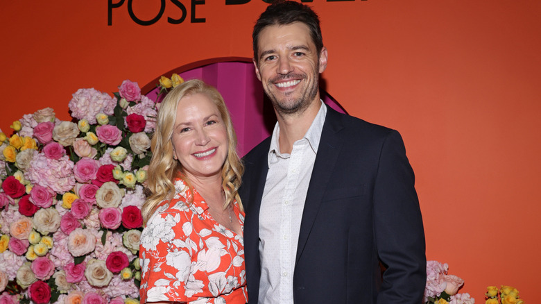 Angela Kinsey and Joshua Snyder on a red carpet