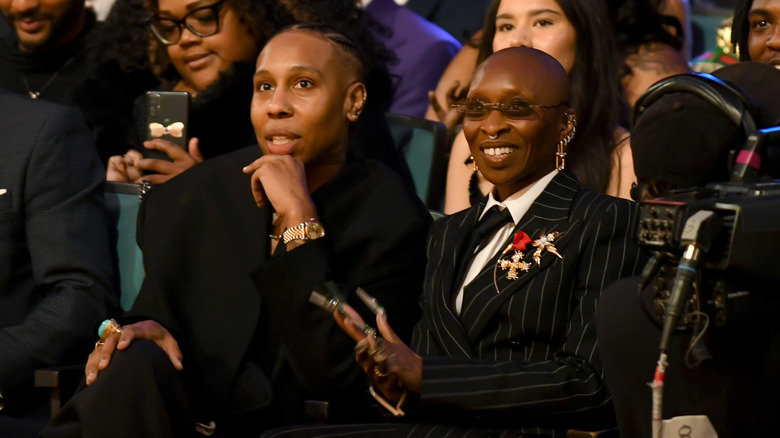 Lena Waithe and Cynthia Erivo sitting in an audience together