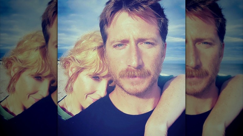 Kelly Reilly hugging Kyle Baugher on the beach