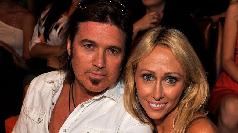 Billy Ray Cyrus sitting alongside Tish Cyrus in an award show audience in 2009