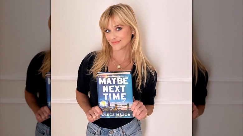 Reese Witherspoon holding Maybe Next Time