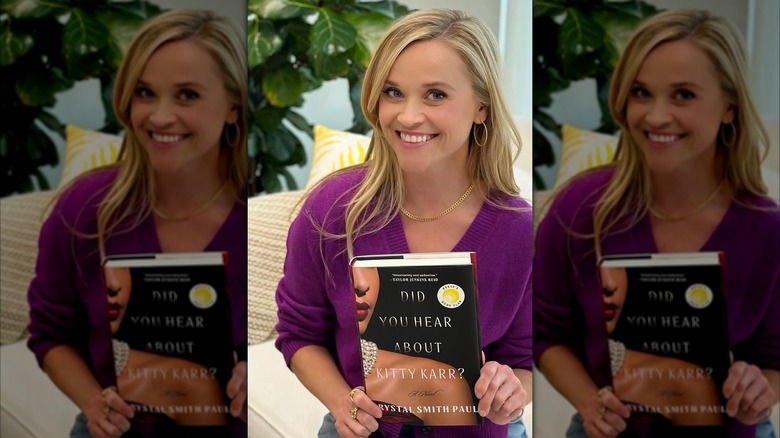 Reese Witherspoon holding Did You Hear About Kitty Karr?
