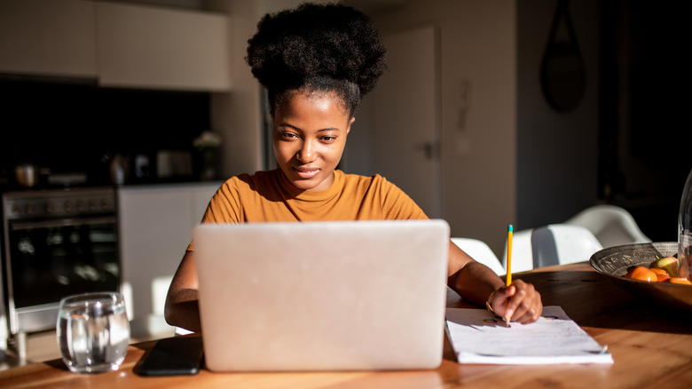 Woman researching on laptop