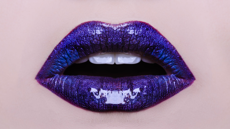 Close up of lips with blue purple chrome look