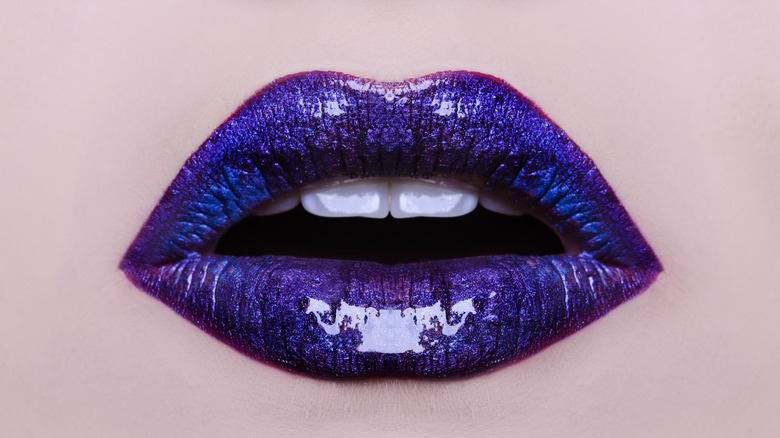 Close up of lips with blue purple chrome look