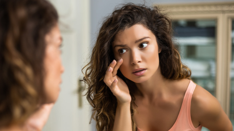 Woman looking in the mirror