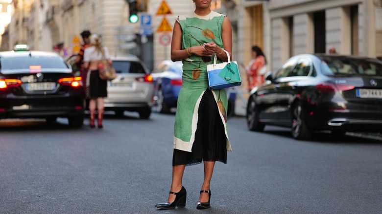 model in street silk dress