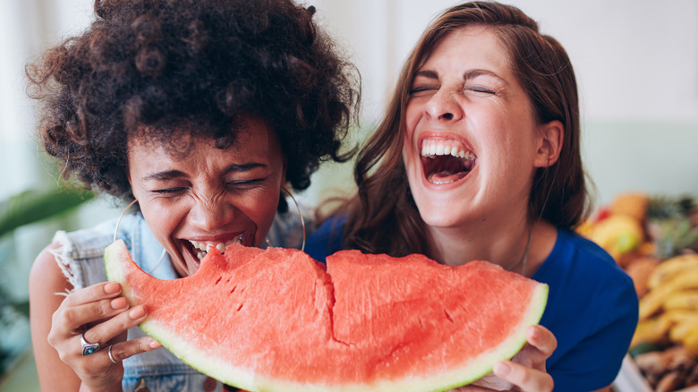 friends eating watermelon