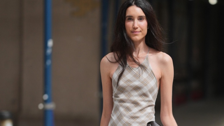 New York Fashion Week guest wears plaid dress