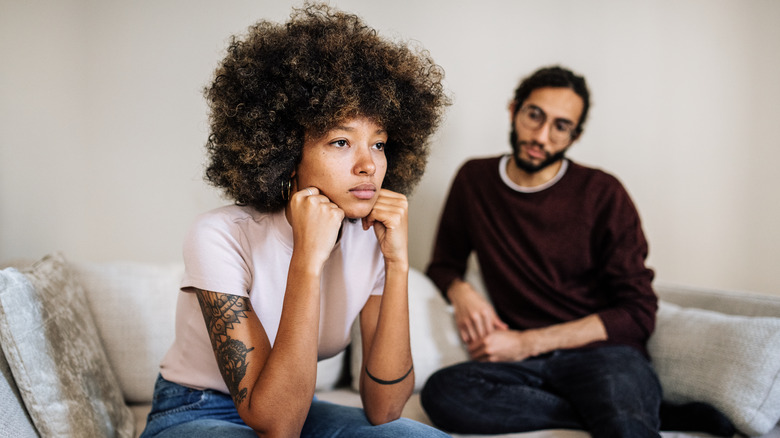 A couple looking unhappy