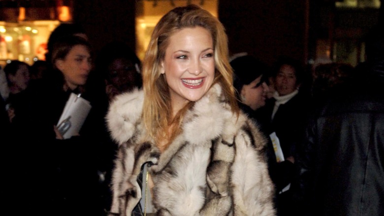 Kate Hudson smiling at an event in 2006