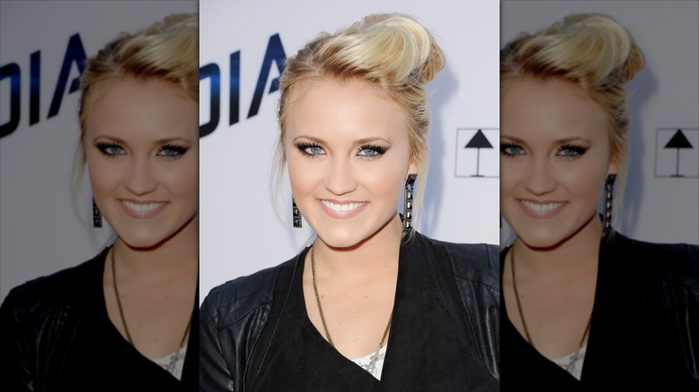 Emily Osment on the red carpet in 2013 with an up-do