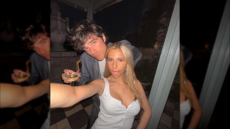 Selfie of Romy Mars sticking her tongue out and posing with Jacob Elordi