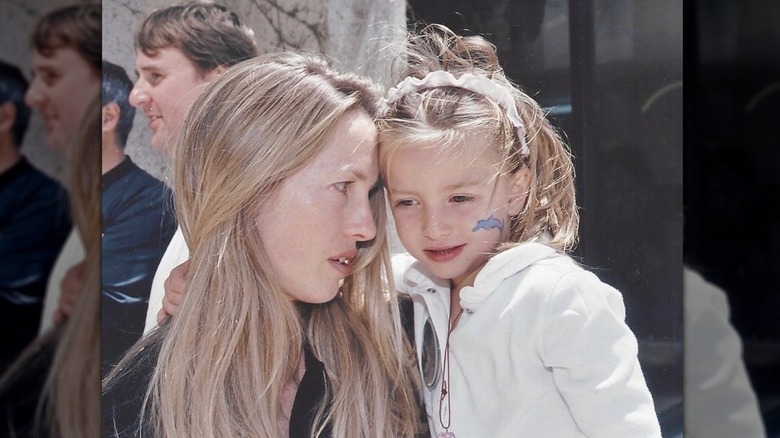 A photo of young Eve Jobs and her mother Laurene Powell Jobs