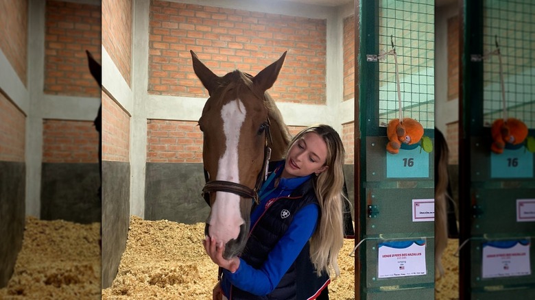 Eve Jobs with her horse she competed with in the 2019 Pan American Games