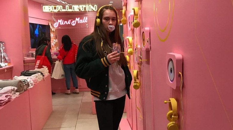 Lola Tung in 2017 wearing a varsity jacket
