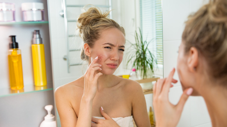 woman in front of mirror