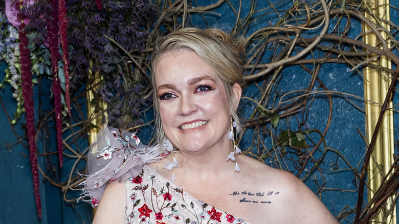 Colleen Hoover in a floral dress